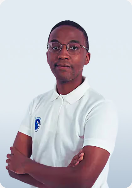 Man with glasses in white polo shirt with arms crossed smiles slightly.