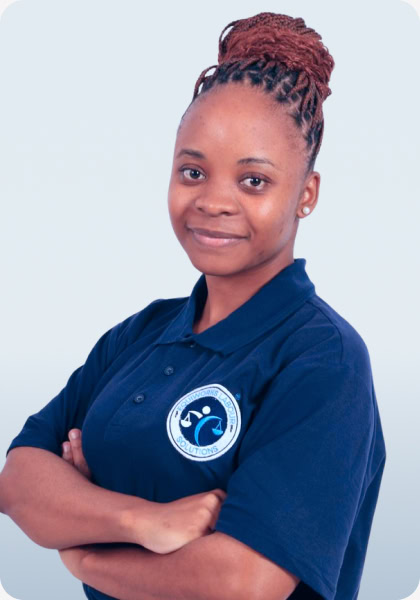 Woman with braided hair smiles, wearing a navy polo shirt with 'Southworks Labour Solutions' logo, arms crossed.